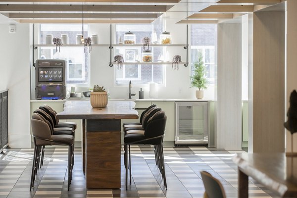 Clubhouse featuring modern design and comfortable seating at Alta Wren Apartments, ideal for social gatherings and community events