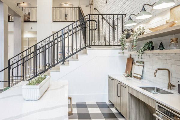 Clubhouse at Alta Wren Apartments: Modern lounge featuring comfy seating and billiards table for residents to enjoy leisure time