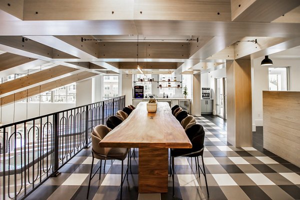 Elegant clubhouse with modern decor at Alta Wren Apartments, ideal for social gatherings and relaxation
