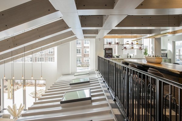 Clubhouse with modern design and comfortable seating at Alta Wren Apartments