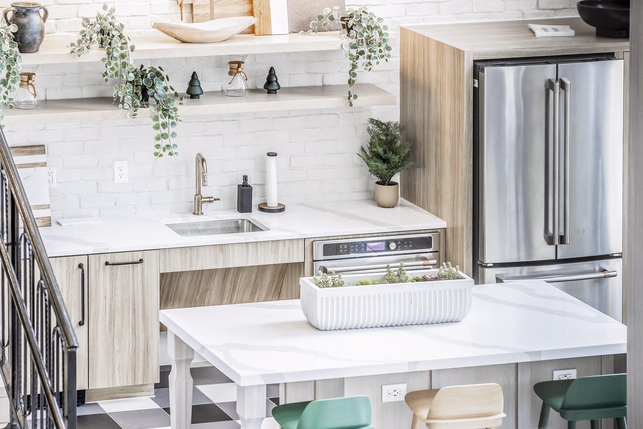 Modern dining area with elegant furnishings at Alta Wren Apartments, featuring ample natural light and stylish design elements