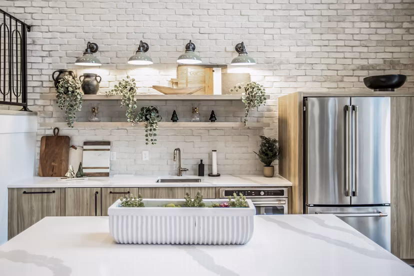 Modern kitchen with stainless steel appliances in Alta Wren Apartments