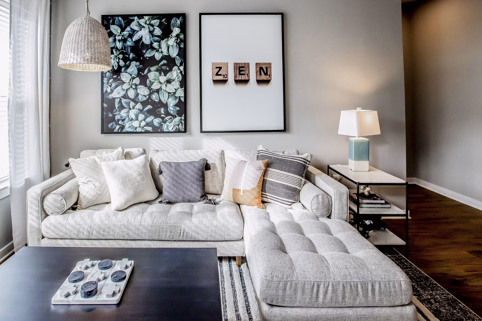 Spacious living room with modern decor and natural light at Alta Wren Apartments, luxury living by Greystar
