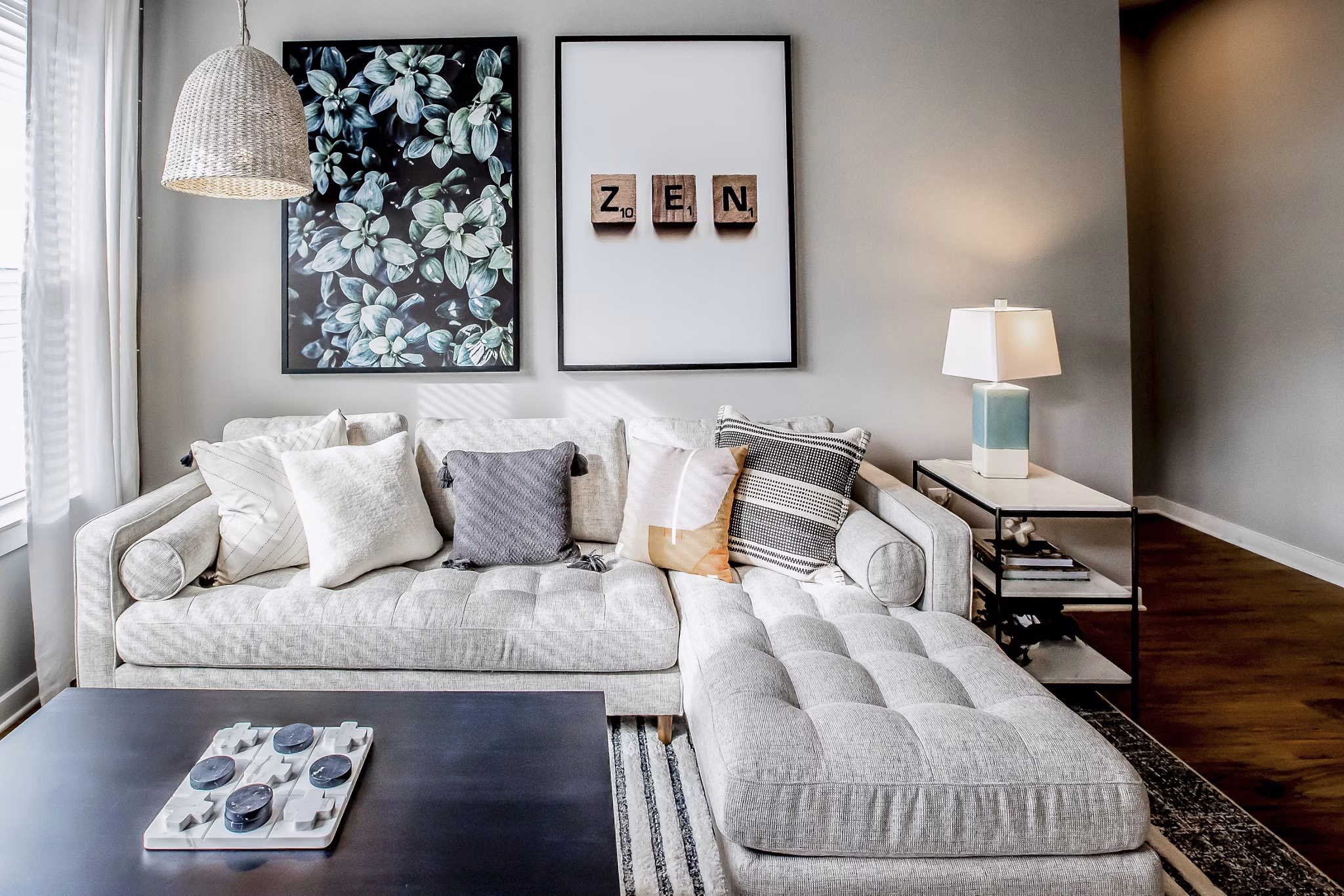Spacious living room with modern decor and natural light at Alta Wren Apartments, luxury living by Greystar