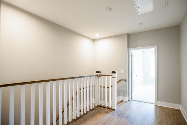 Stylish living room with modern furnishings and natural light at Alta Wren Apartments