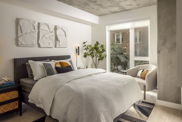 Cozy bedroom with modern decor at The Brady Apartments, luxury living in a central location