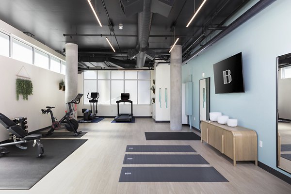 Fitness center with modern equipment at The Brady Apartments