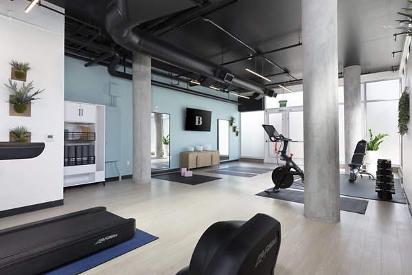 The Brady Apartment: Modern fitness center with state-of-the-art equipment and spacious workout areas