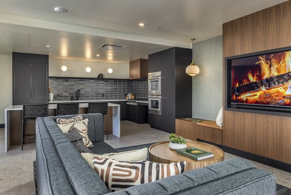 Spacious living room with modern decor at The Brady Apartments featuring upscale amenities
