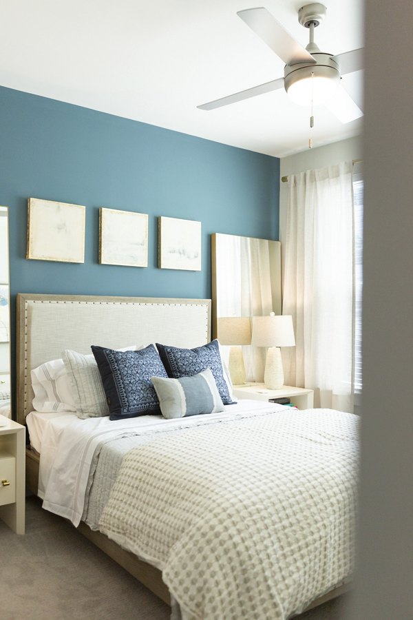 Elden Galleria Apartments: Modern bedroom with elegant furnishings and natural light