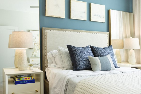 Elden Galleria Apartments: Modern bedroom with stylish decor and ample natural light