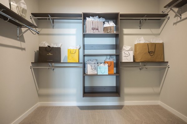 Elden Galleria Apartments: Modern bedroom with sleek furnishings and large window views