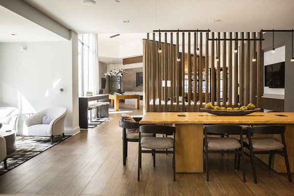 Clubhouse featuring modern decor and seating at Elden Galleria Apartments