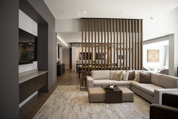 Clubhouse featuring modern design and comfortable seating at Elden Galleria Apartments
