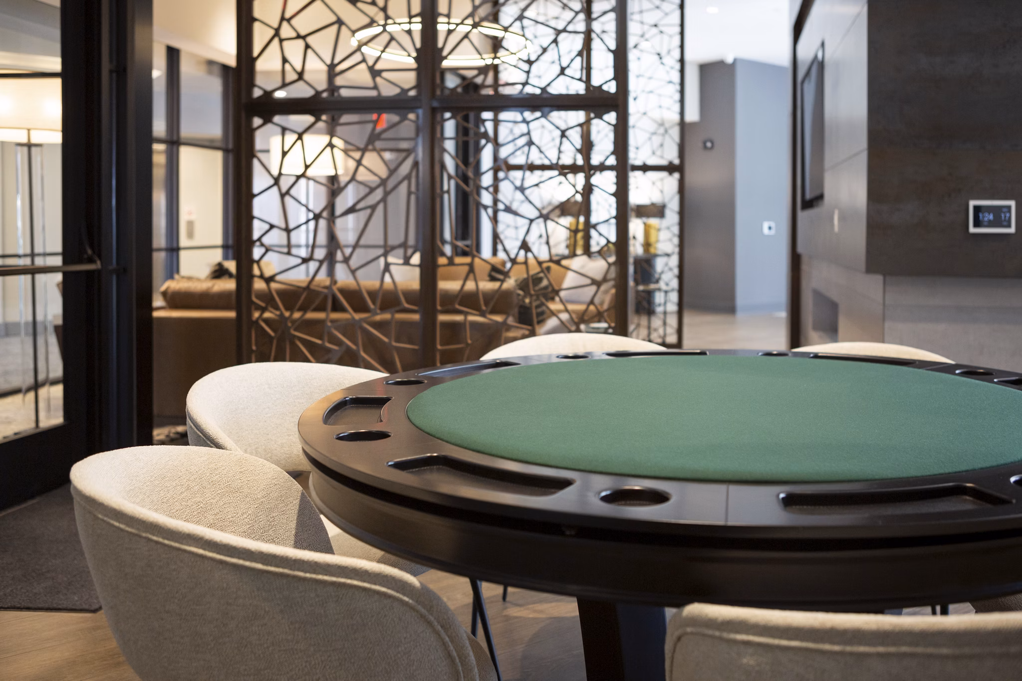 Clubhouse with modern furnishings at Elden Galleria Apartments, featuring social spaces and entertainment areas