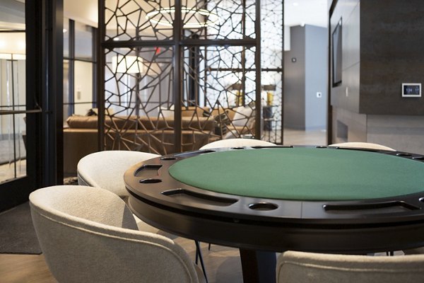 Clubhouse with modern furnishings at Elden Galleria Apartments, featuring social spaces and entertainment areas