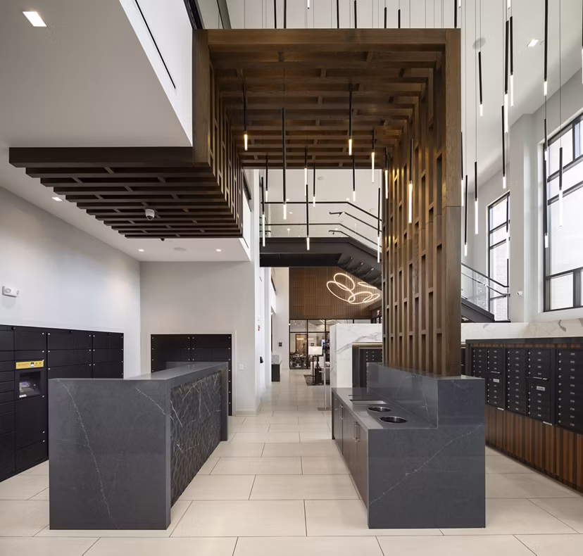 Clubhouse featuring contemporary design and open seating at Elden Galleria Apartments