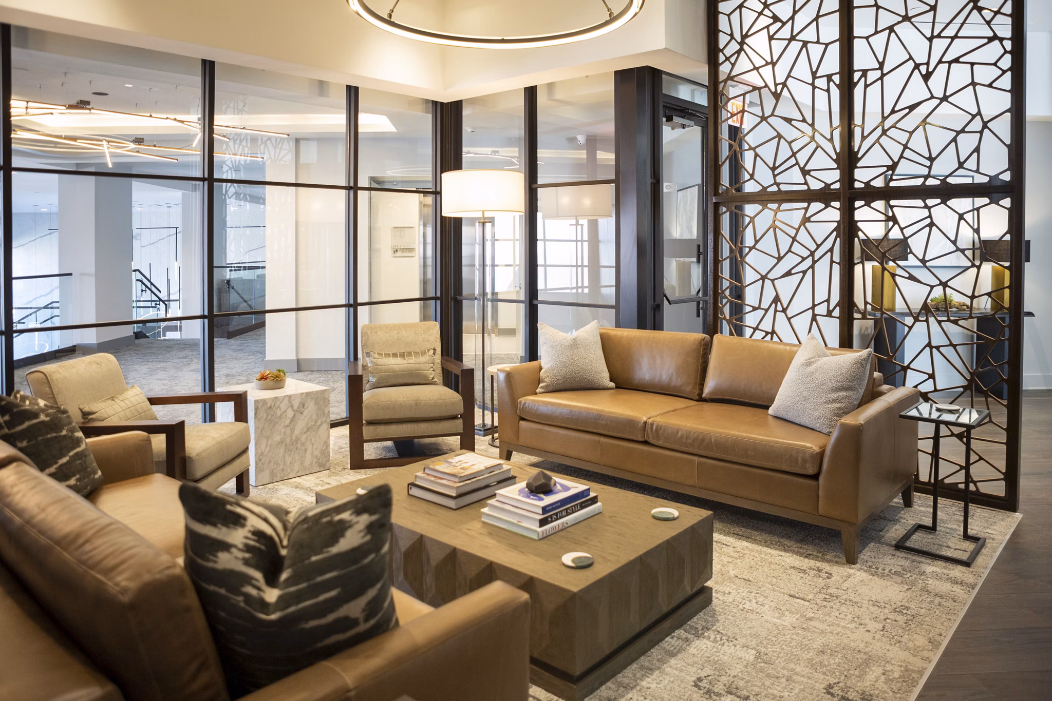 Clubhouse featuring contemporary design and open seating at Elden Galleria Apartments