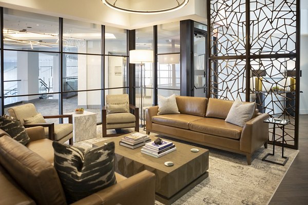 Clubhouse featuring contemporary design and open seating at Elden Galleria Apartments