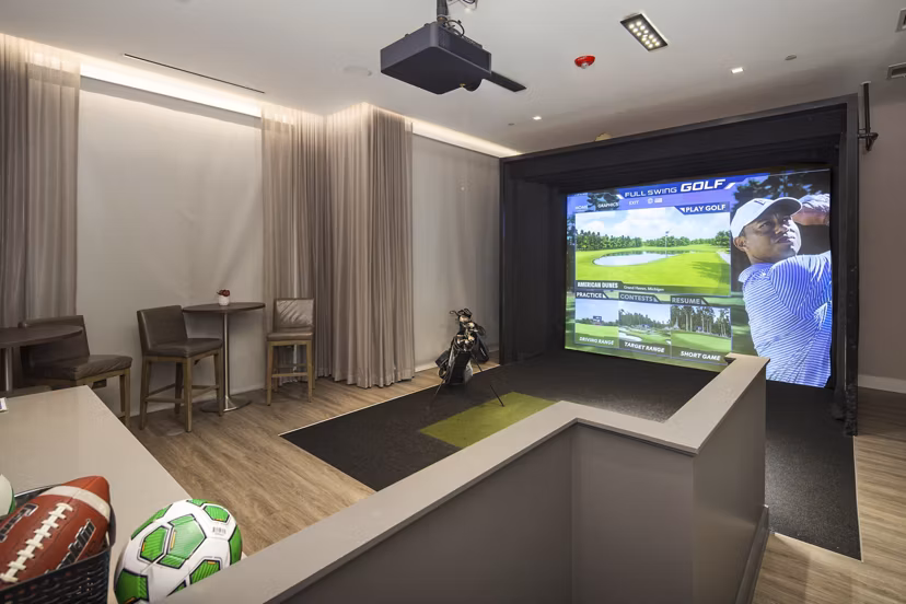 Clubhouse featuring modern decor and cozy seating at Elden Galleria Apartments, luxury community amenities for relaxation and socializing