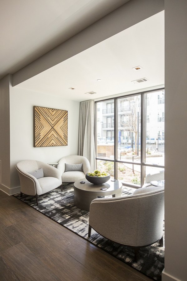 Elden Galleria Apartments: Modern clubhouse featuring chic interiors and cozy seating areas