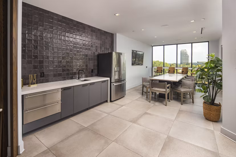 Elden Galleria Apartments: Modern clubhouse featuring open seating and contemporary design