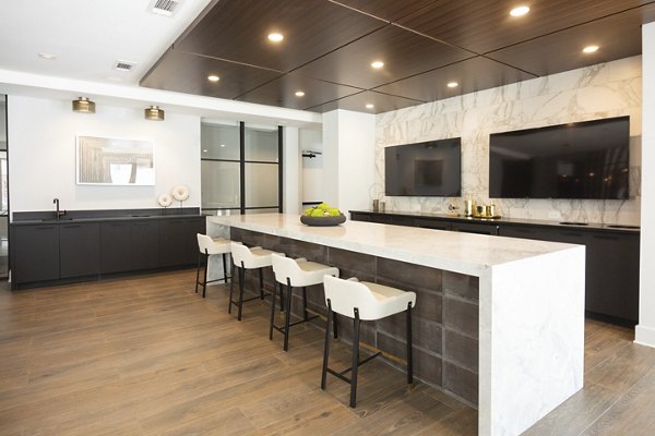 Elden Galleria Apartments: Modern clubhouse featuring open seating and contemporary design
