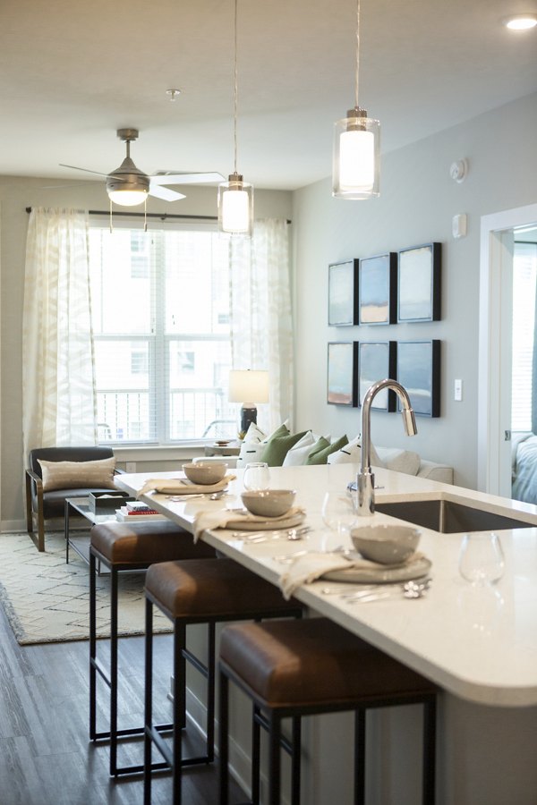 Dining area featuring modern decor and elegant lighting in Elden Galleria Apartments