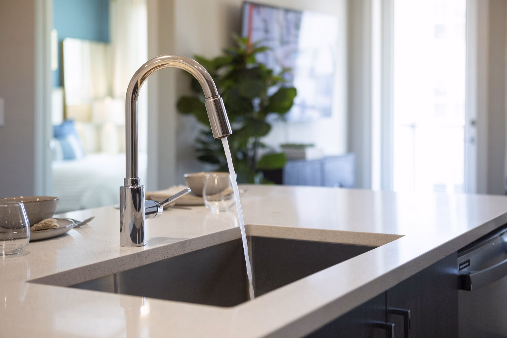 Modern kitchen with stainless steel appliances at Elden Galleria Apartments in Greystar's luxury portfolio