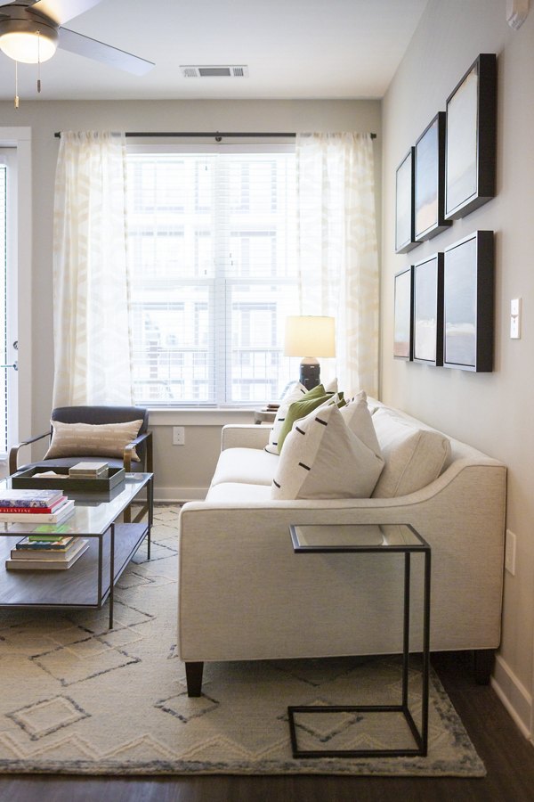 Living room featuring modern furniture and open layout at Elden Galleria Apartments luxury apartments