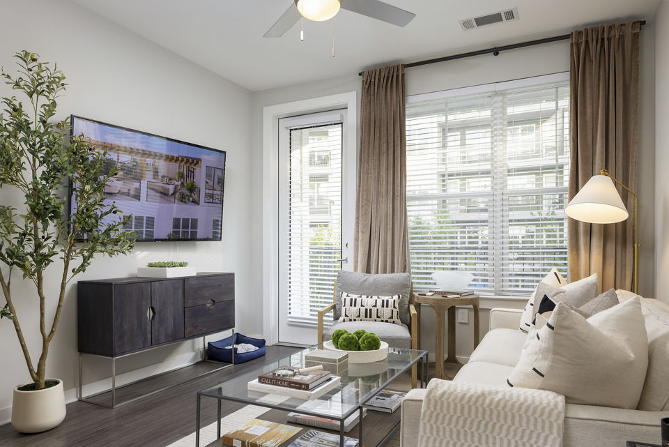 Living room featuring modern furniture and open layout at Elden Galleria Apartments luxury apartments