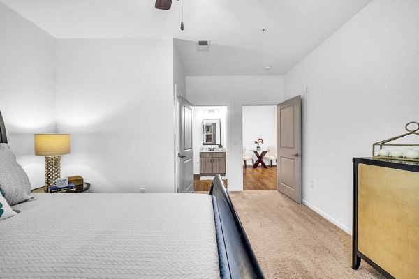 Elegant bedroom with modern decor at Fox Hunt Farms Apartments