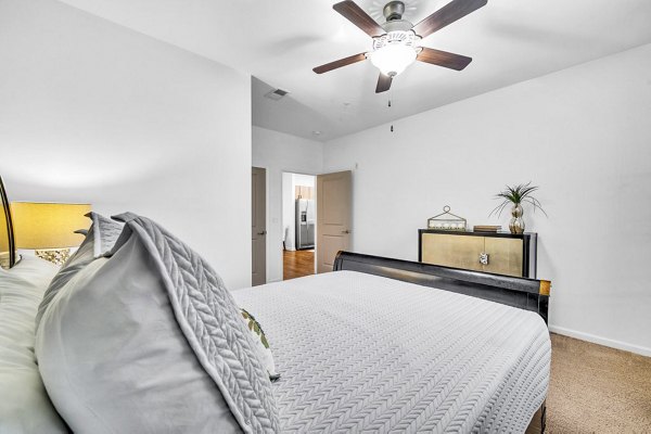 Cozy bedroom with modern design at Fox Hunt Farms Apartments