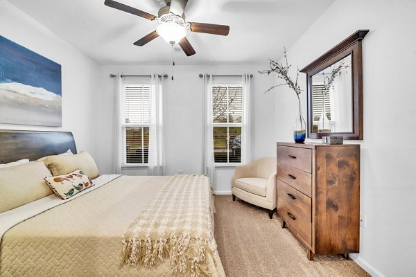 Cozy bedroom with modern decor at Fox Hunt Farms Apartments
