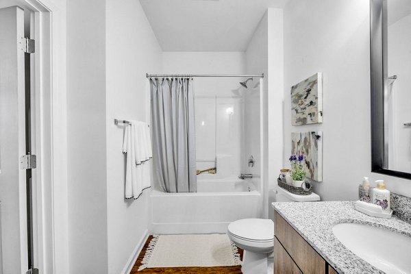 Modern bathroom with sleek fixtures at Fox Hunt Farms Apartments featuring luxury amenities