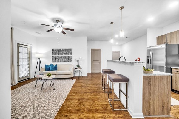Spacious living room with modern furnishings in Fox Hunt Farms Apartments
