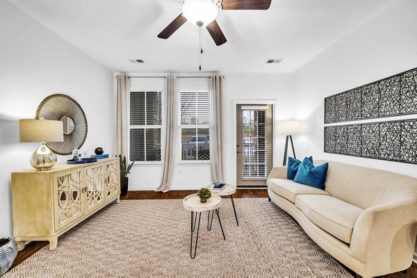 Cozy living room with modern furniture at Fox Hunt Farms Apartments, perfect for relaxation and entertainment