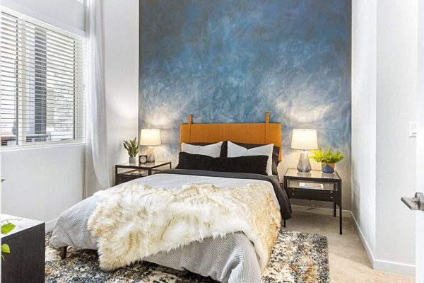 Cozy bedroom with elegant decor at Jefferson Cenza Apartments