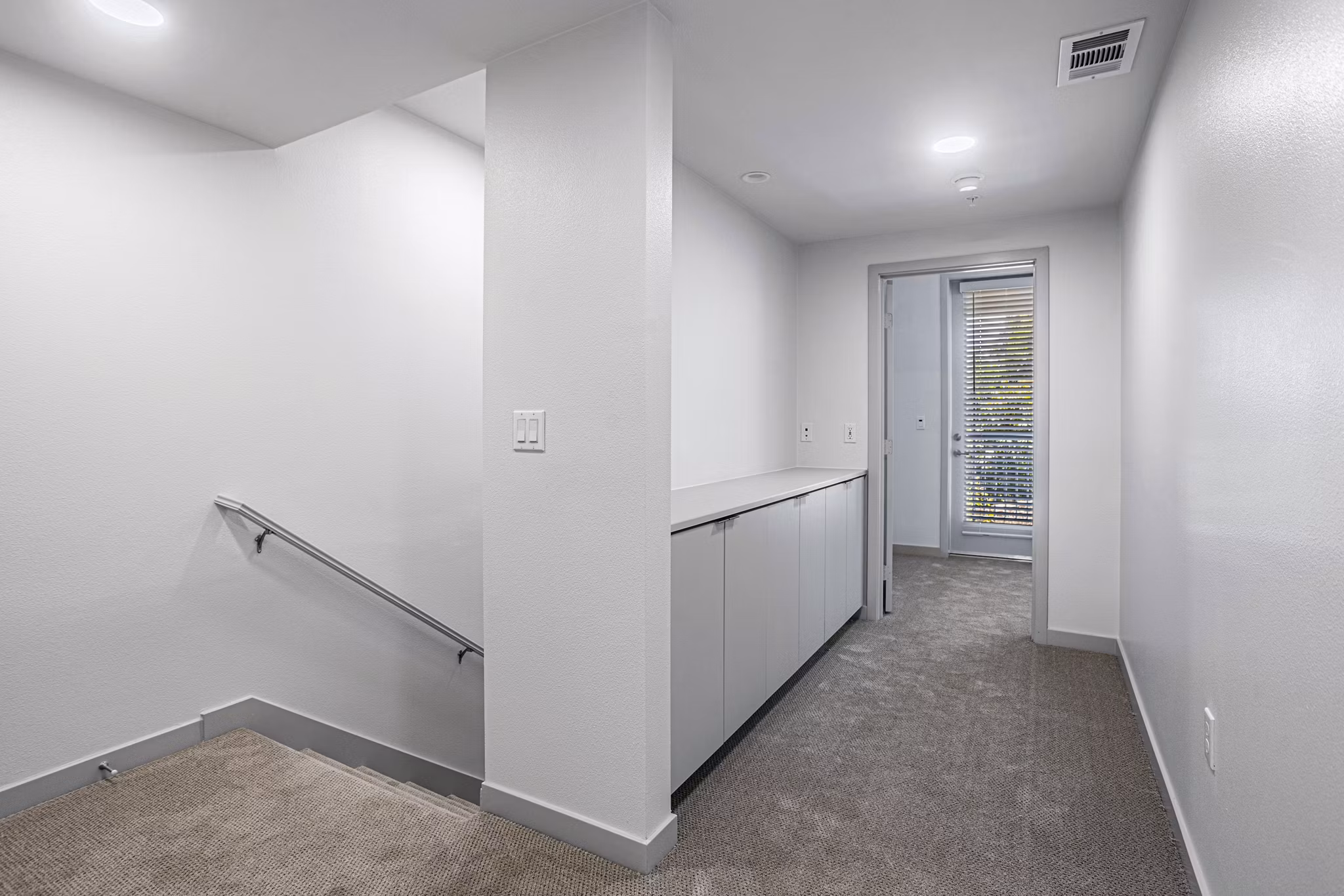 Bedroom featuring modern decor and natural light at Jefferson Cenza Apartments