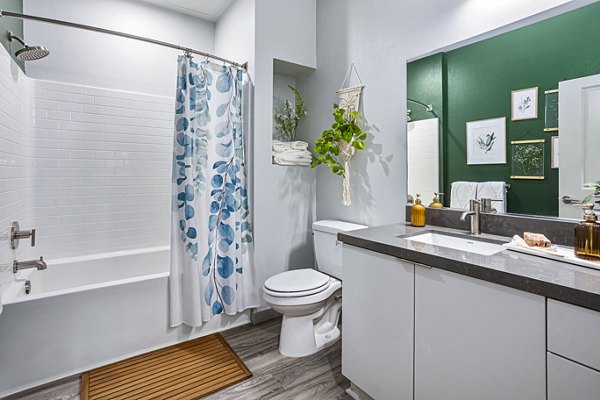 Contemporary bathroom with sleek fixtures at Jefferson Cenza Apartments luxury residence