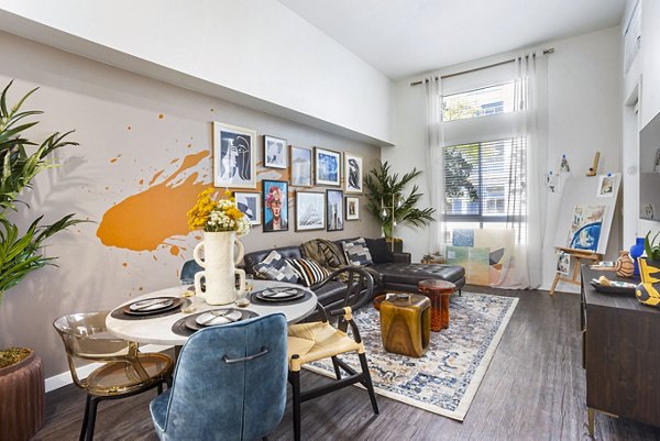 Dining room featuring elegant lighting and modern decor at Jefferson Cenza Apartments