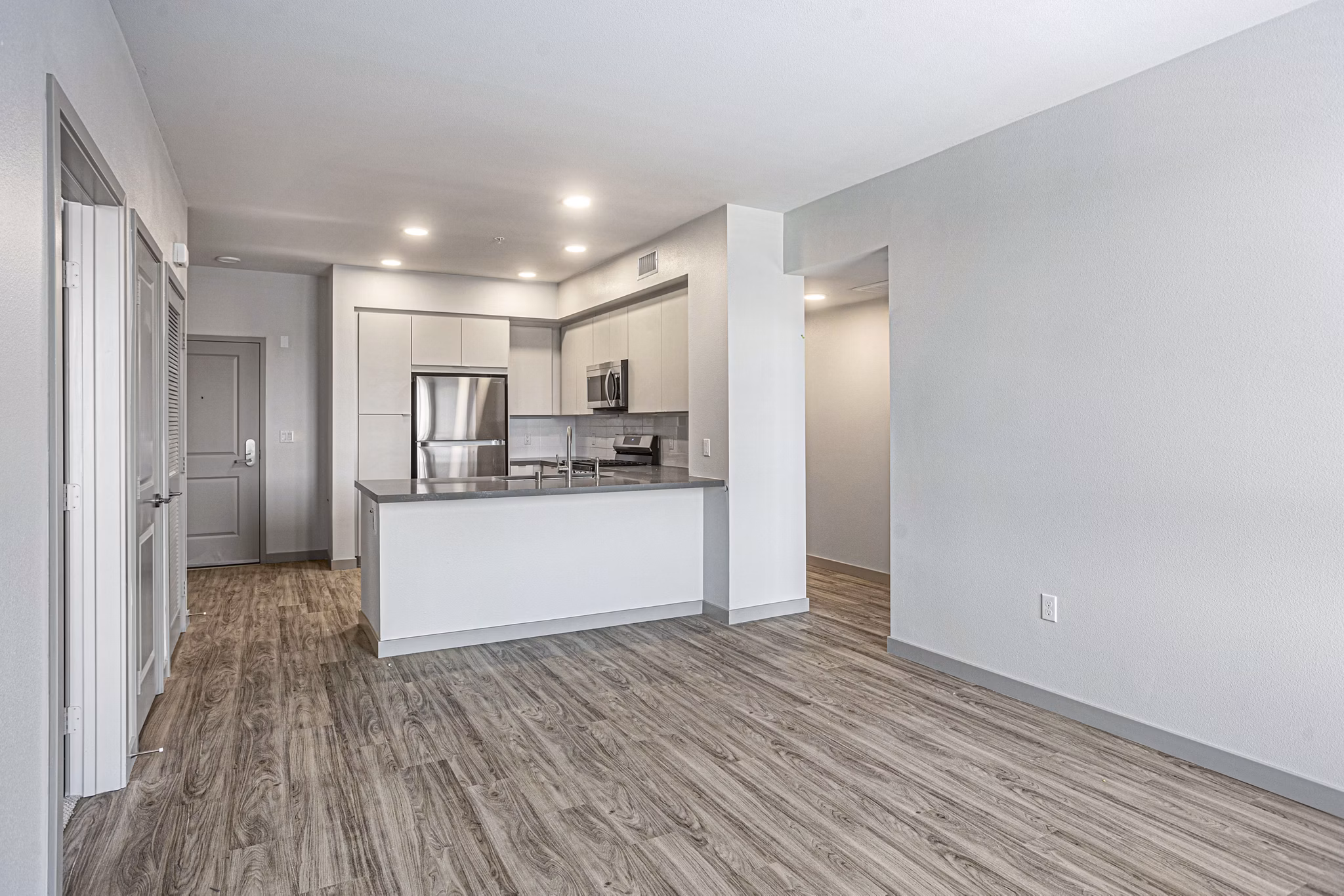 Spacious living room with modern decor in Jefferson Cenza Apartments offers luxury living experience