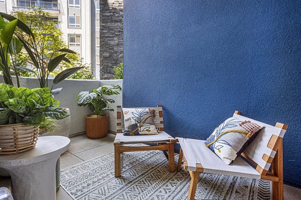 Spacious patio with modern furnishings at Jefferson Cenza Apartments, ideal for luxury outdoor living