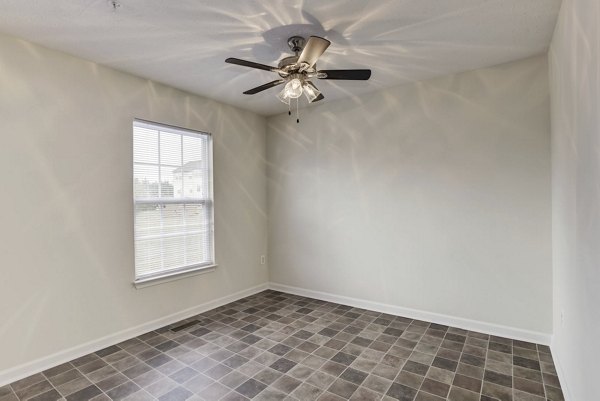 Cozy bedroom with modern furnishings at Kaiser Park Apartments