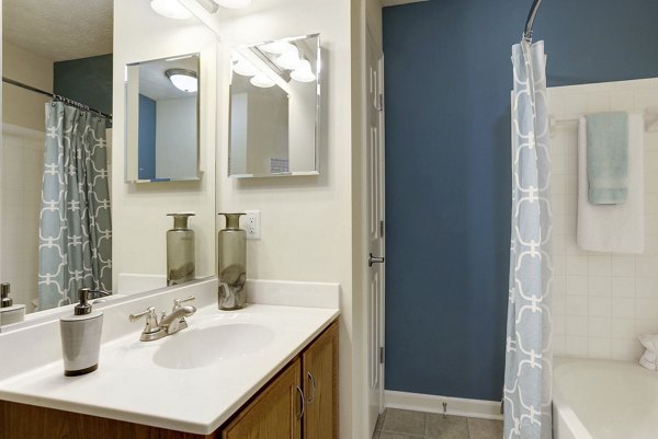 Modern bathroom featuring sleek fixtures and marble countertop in Kaiser Park Apartments