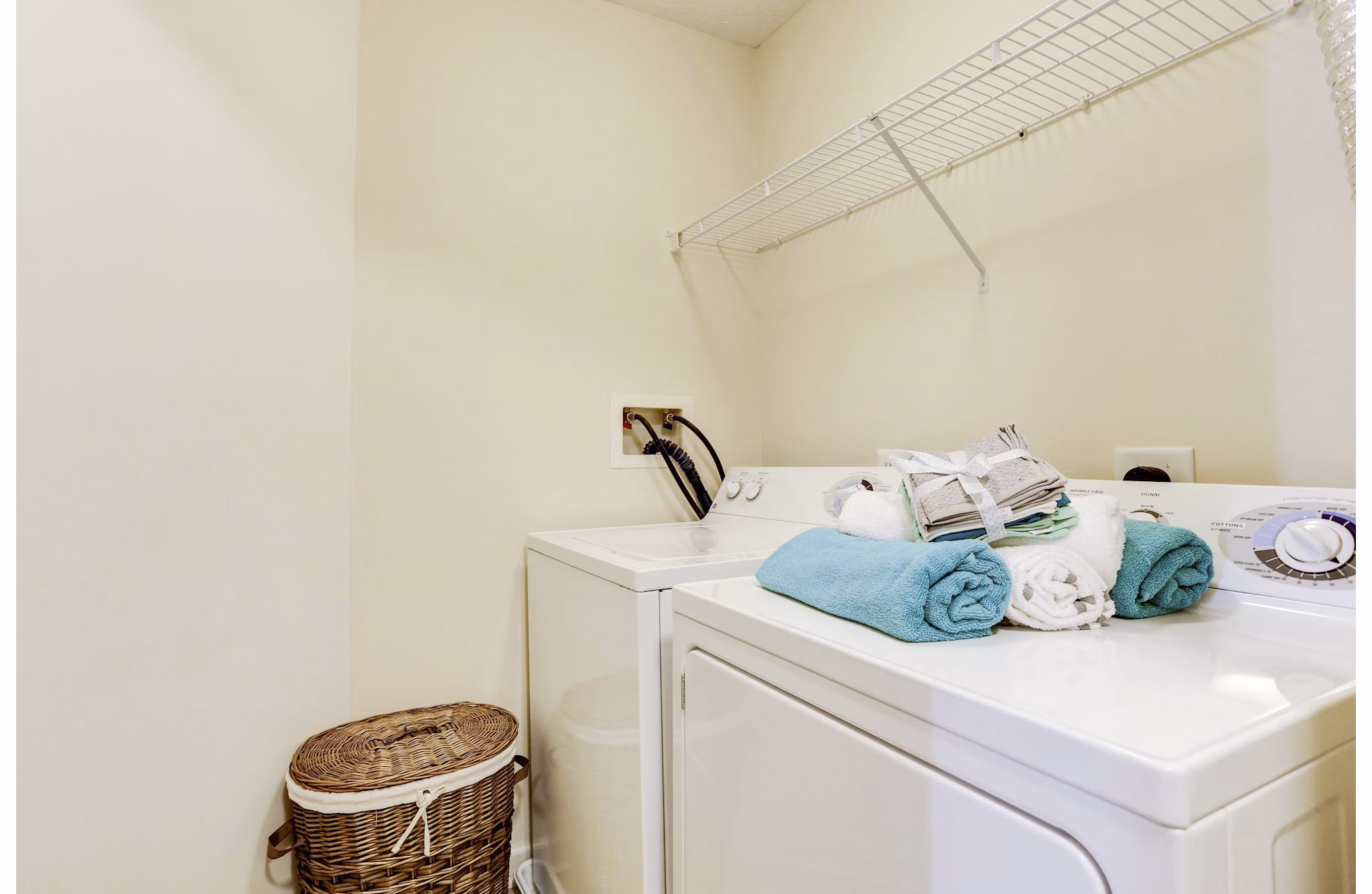 Laundry room with energy-efficient machines at Kaiser Park Apartments