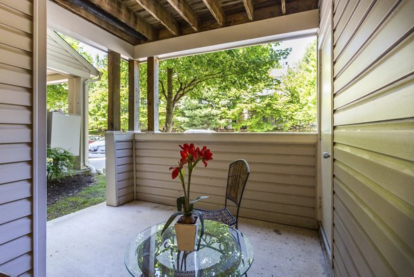 Spacious patio with modern seating at Kaiser Park Apartments
