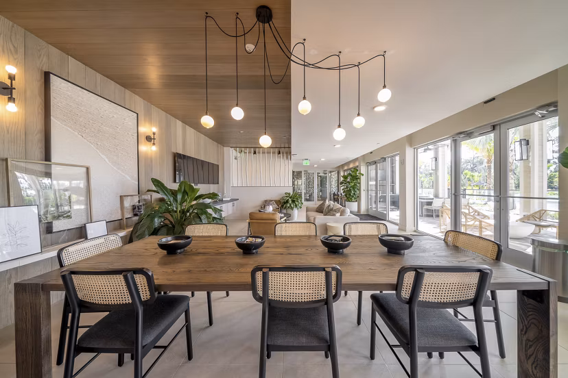 Clubhouse featuring modern decor and ample seating at Novel Nona Apartments
