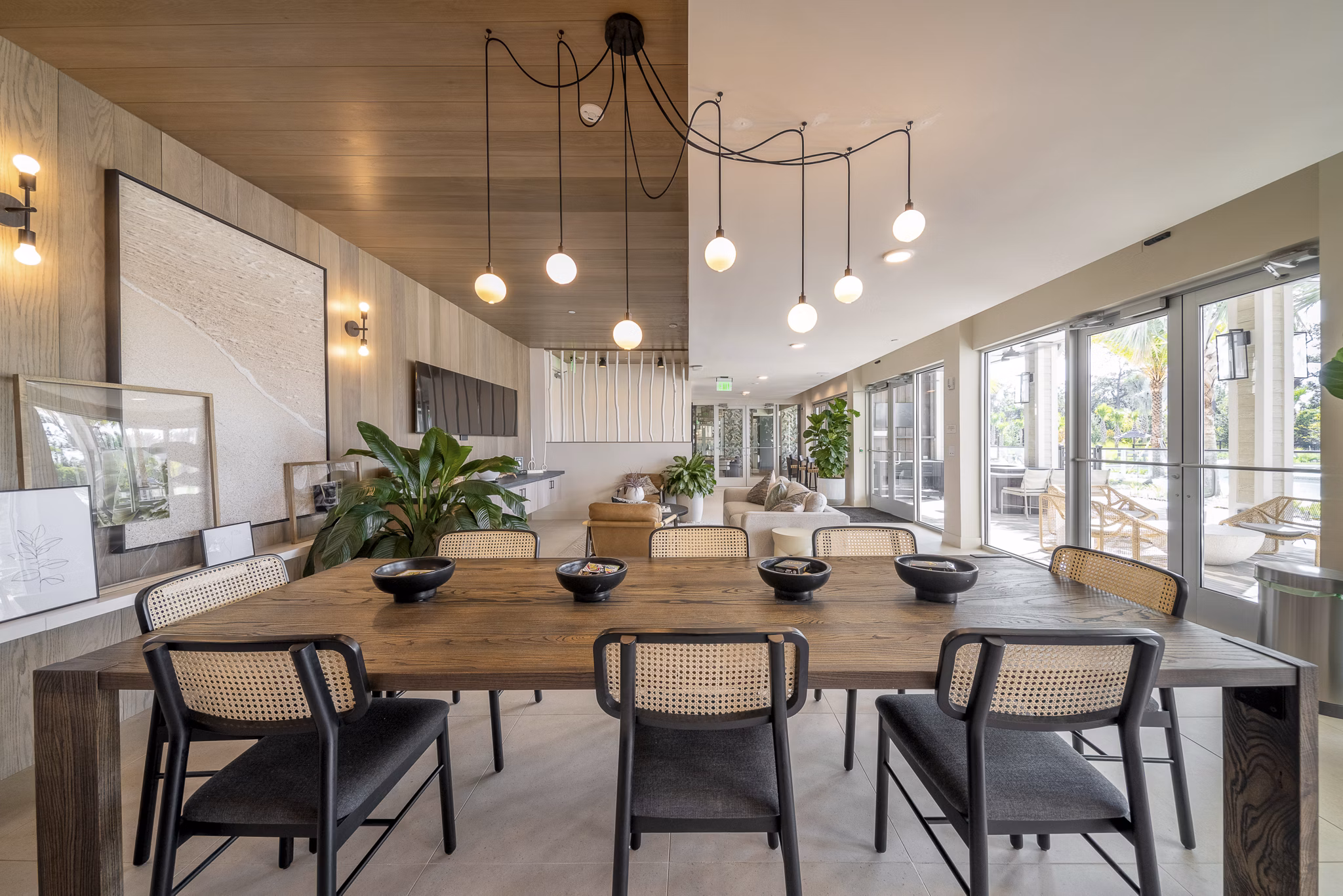 Clubhouse featuring modern decor and ample seating at Novel Nona Apartments