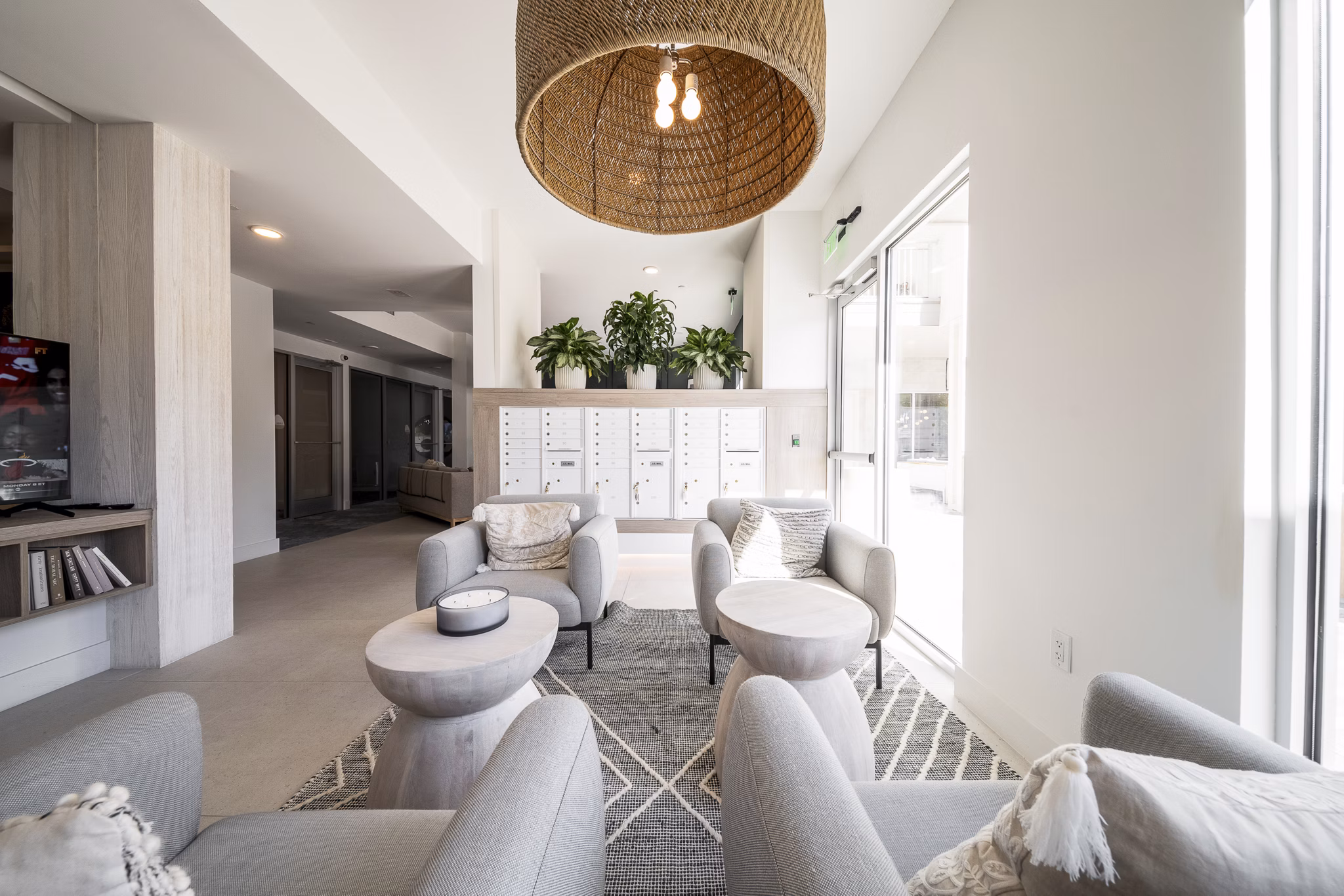 Clubhouse with modern furnishings at Novel Nona Apartments featuring luxury living spaces for relaxation and socializing